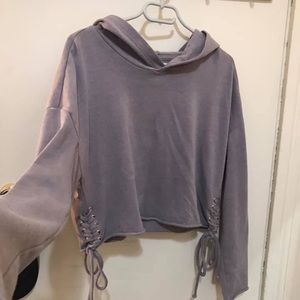 Cropped pullover hoodie with crisscross bottom